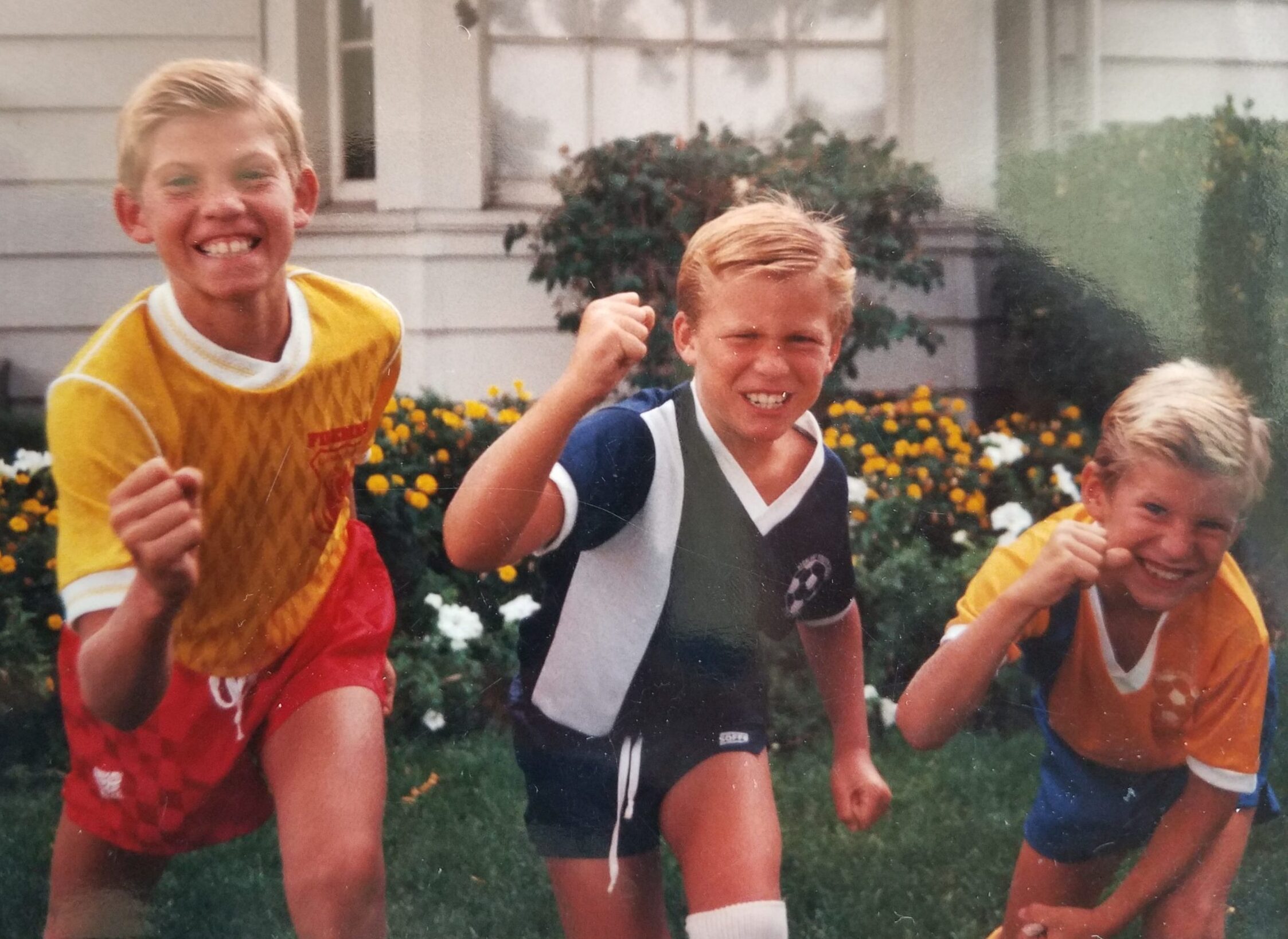 Tyler, Brannon, and Rex Patrick as kids dressed in soccer uniforms ready for action!